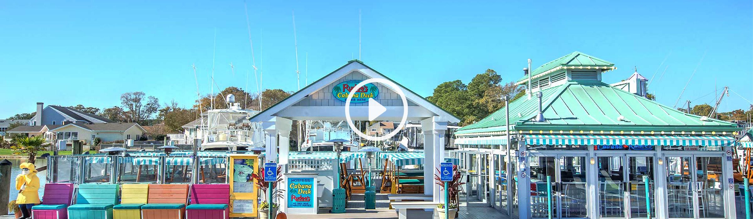 Rudee's outdoor view of the cabana and boats